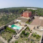 An aerial view of Villa Cappelli, a house with a swimming pool in Puglia, Italy.