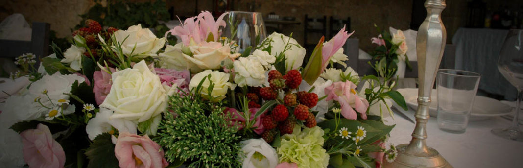 An arrangement of local Italian flowers on a table.