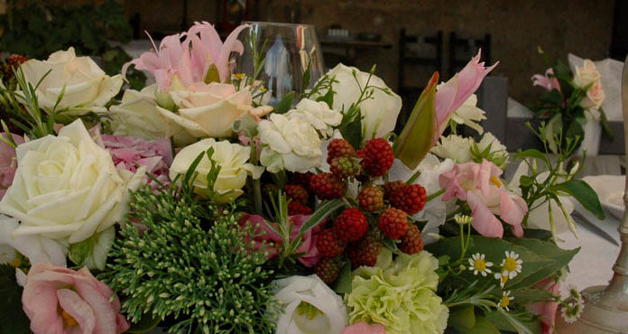 006: Local Italian flowers, foraging for mushrooms, and more! An arrangement of local Italian flowers on a table.