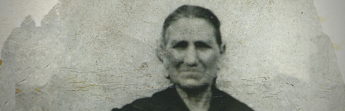 009: Italian ancestry and discovering your heritage A woman of Italian ancestry captured in a black and white photograph, exploring her heritage.