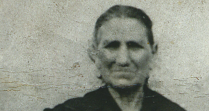 009: Italian ancestry and discovering your heritage A woman of Italian ancestry captured in a black and white photograph, exploring her heritage.