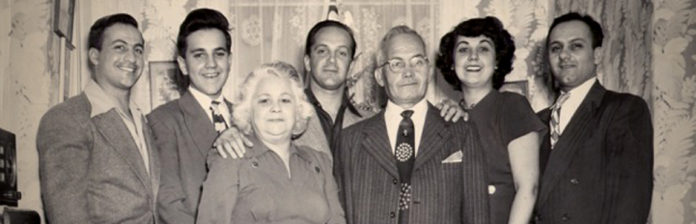 015: Finding family and returning home to Italy A black and white photo capturing a family's connection, as they mysteriously find each other and return to their homeland in Italy.