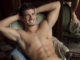 014: Art and photography with photographer Paul Freeman Art and photography featuring a shirtless man posing in front of a mirror, captured by renowned photographer Paul Freeman.