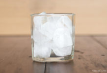 Italian Travel Tip: Ice Italian Travel Tip: Enjoy a refreshing glass of ice-cold water on a wooden table.
