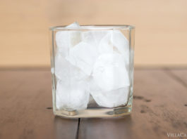 Italian Travel Tip: Ice Italian Travel Tip: Enjoy a refreshing glass of ice-cold water on a wooden table.