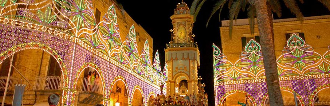 A vibrant cityscape showcasing an illuminated building during a captivating Italian feast.